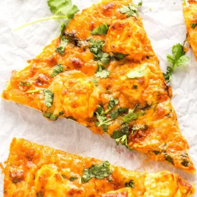 Fresh signature cheese pizza at Nose Creek Pizza in Coventry Hills, Calgary, AB