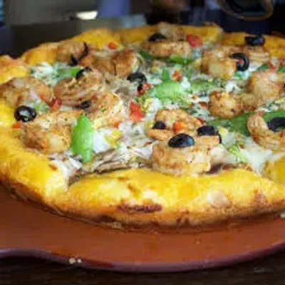 Delicious specialty pizzas including Meat Lovers and Butter Chicken at Nose Creek Pizza Calgary